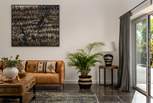 Rustic interior touches and original artwork promise a serene spot to reside