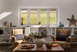 Seek contemporary comfort in the spacious main living room