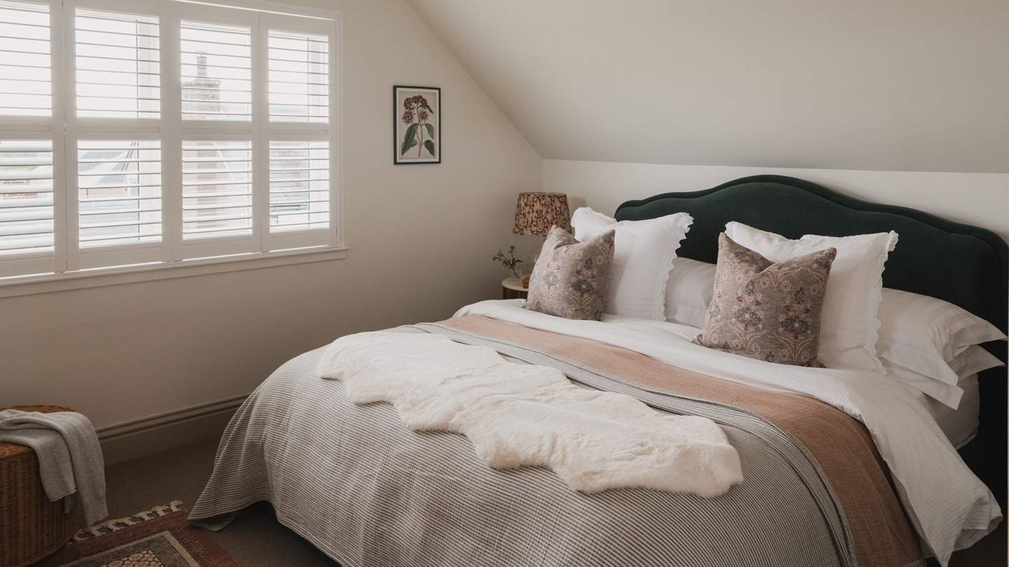 The second bedroom is a luxurious space to rest, with a super king size bed 