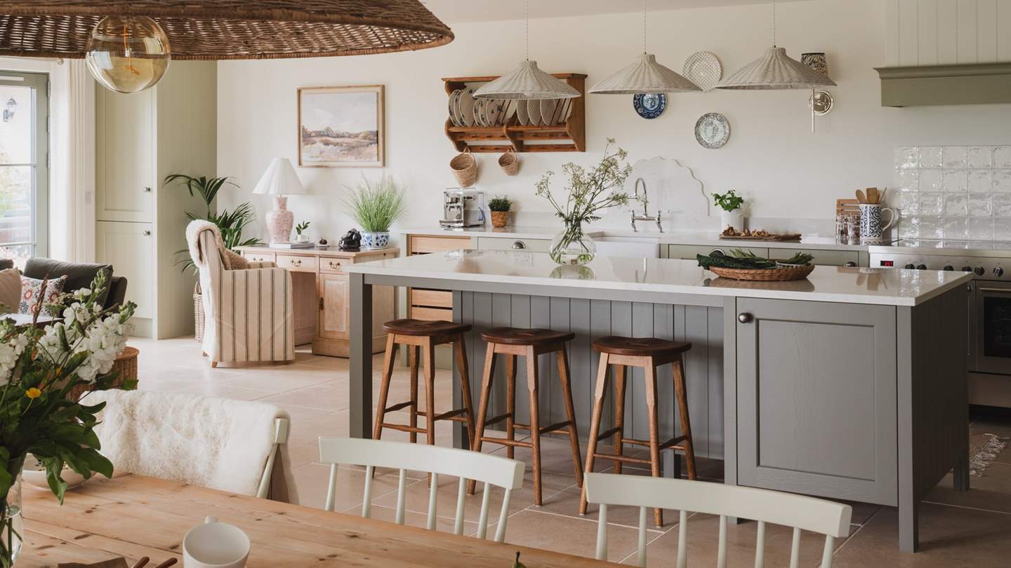 A large island and overhead lighting invites you to host into the late hours