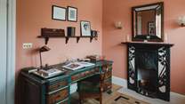 This dedicated workcation space is complete with an antique hand painted desk