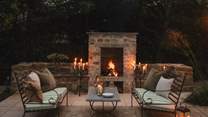 Evenings are even dreamier, seeking candlelit moments gathered around the outdoor stone fireplace with your kin