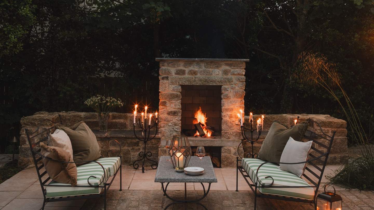 Evenings are even dreamier, seeking candlelit moments gathered around the outdoor stone fireplace with your kin