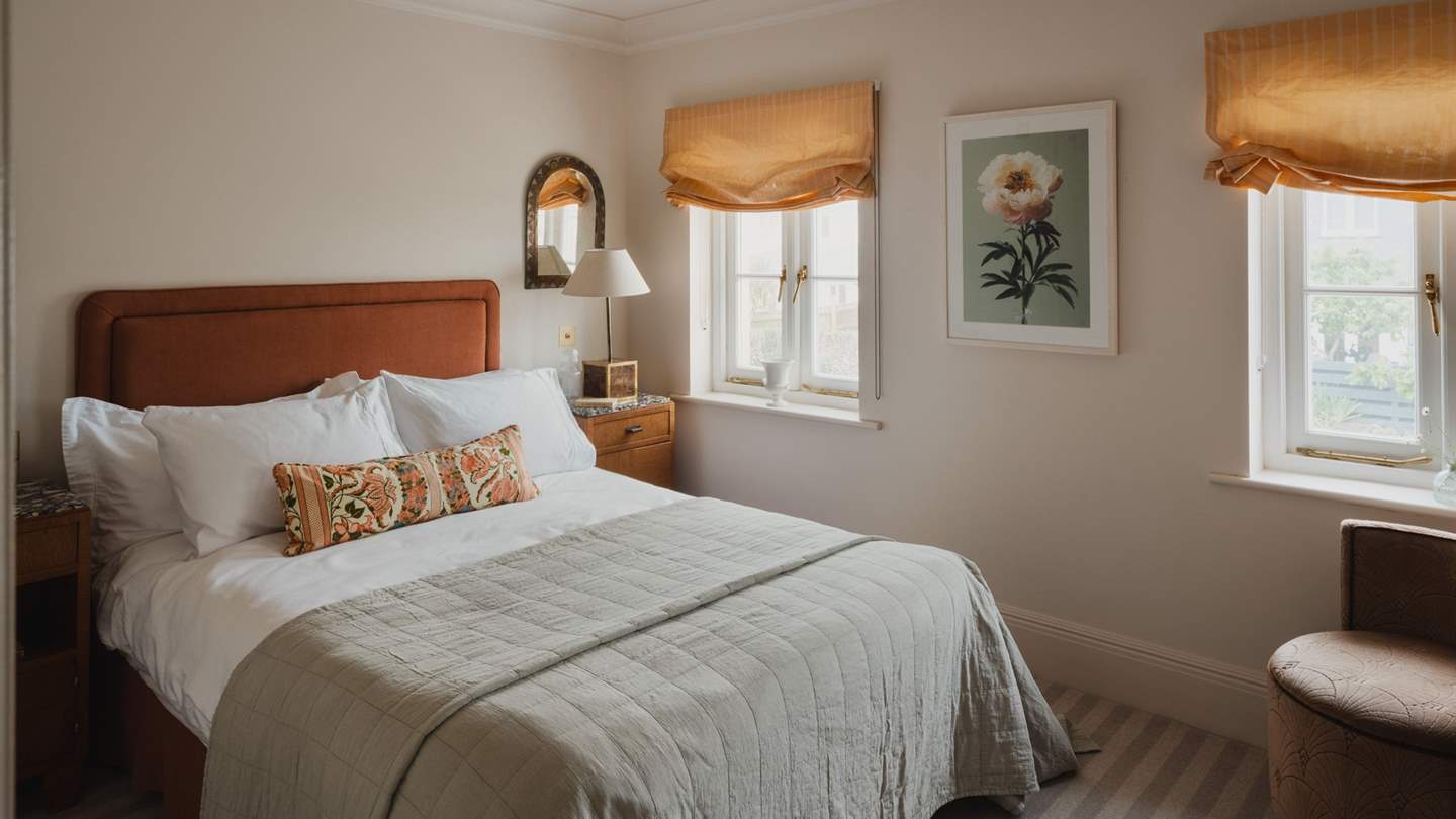 Mirroring the neighbouring bedroom is a third double bedroom and en suite with complementing interiors 