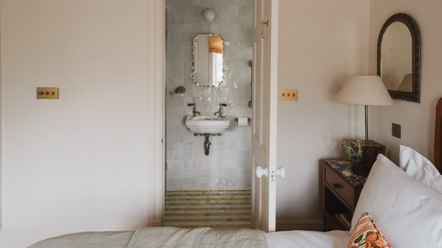 A charming striped tile pattern matches the stylish carpet