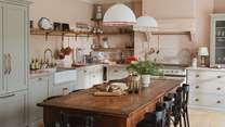 A picture of classic English elegance, the timeless bespoke kitchen by deVOL is the heart of the home