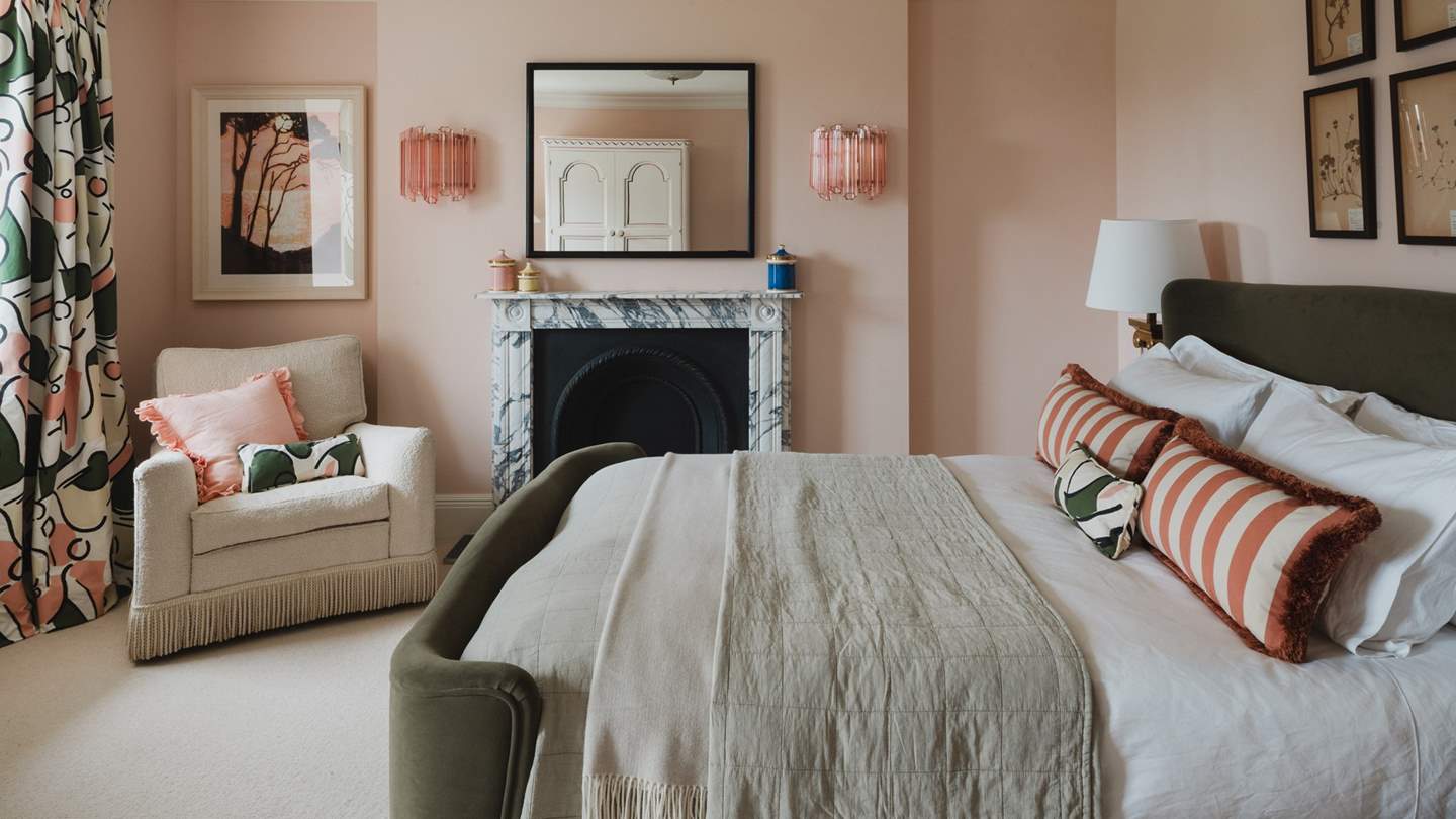 A dreamy combination of pinks and greens, the fourth bedroom is effortlessly romantic