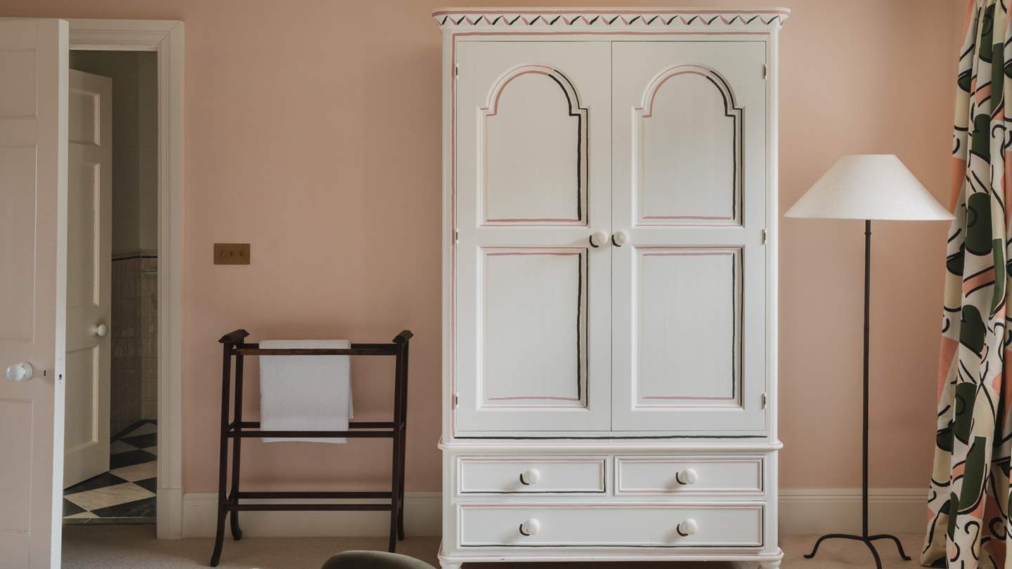 Another gorgeous hand-painted pine wardrobe stores your finest staycation garments 