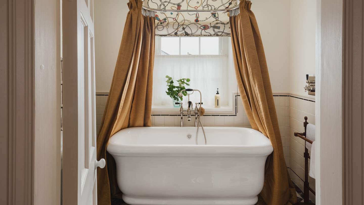 Self-care heaven resides in the stunning family bathroom, where the Paris freestanding bathtub by Water Monopoly is an opulent setting to while the hours in bubble-topped bliss