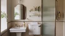In the elegant en suite is a walk-in Lefroy Brooks shower and basin by Water Monopoly