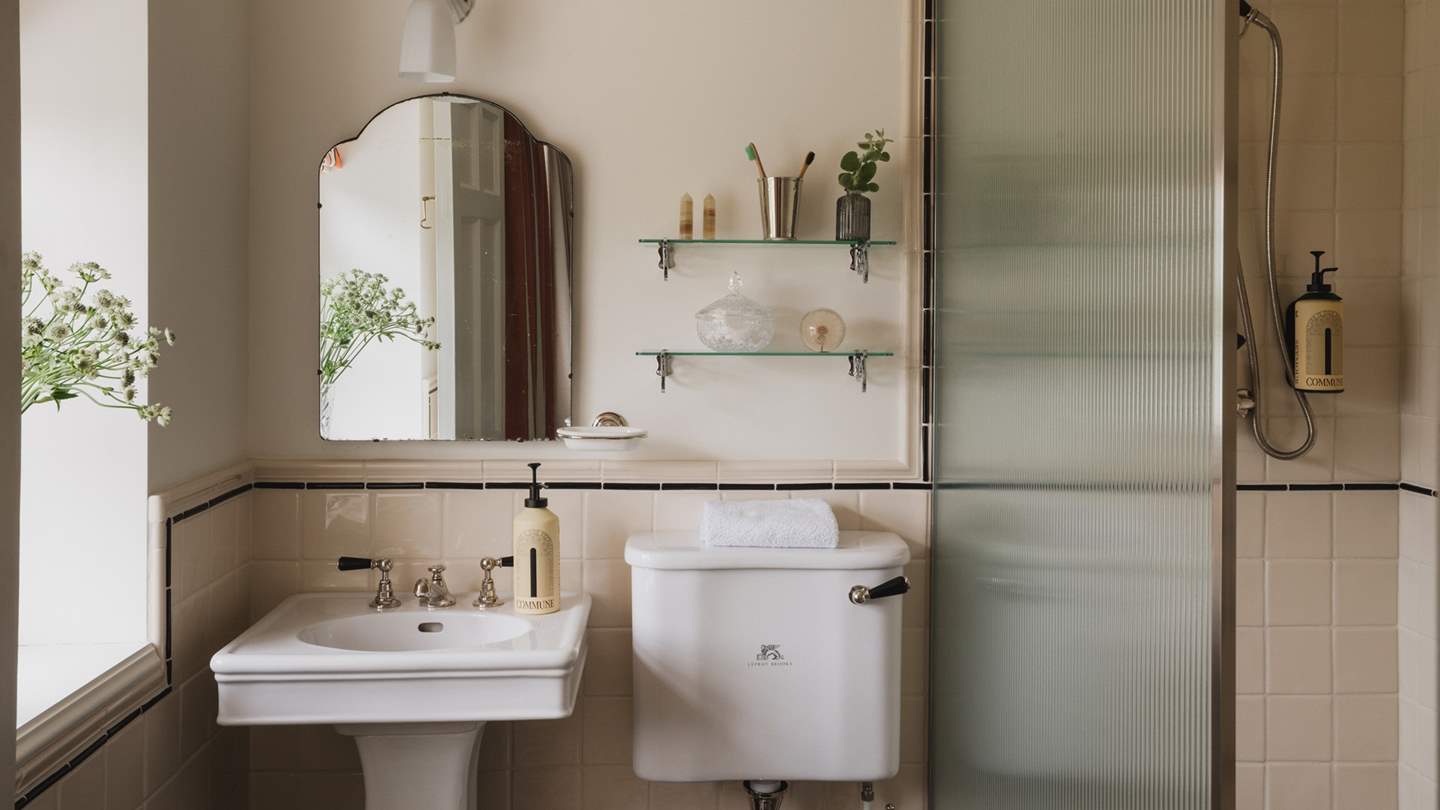 In the elegant en suite is a walk-in Lefroy Brooks shower and basin by Water Monopoly