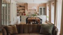 A sumptuous space for creating culinary treasures with blush pink marble worktops and shaker cabinetry, you’ll find all you could require for exquisite home banquets in the kitchen