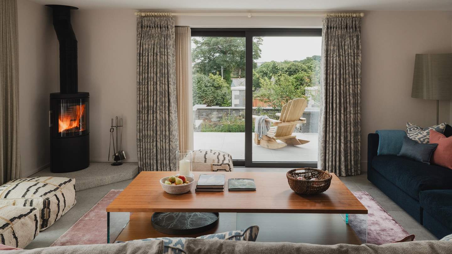 At the heart of living space is the modern wood burning stove, gathering by stylish and ample sofas by Flexform