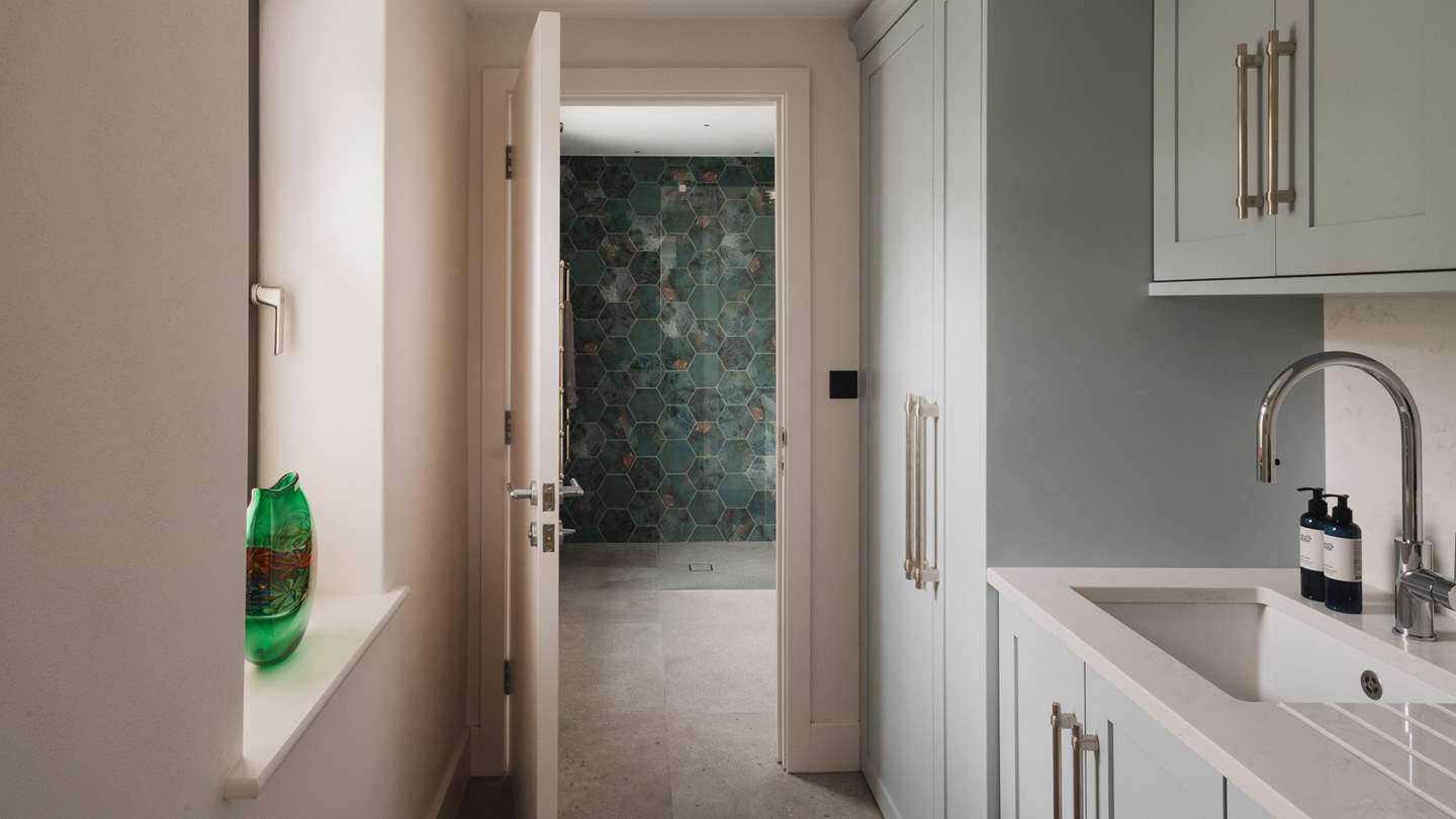 In the utility, you’ll find the washing machine and tumble dryer, along with a separate sink