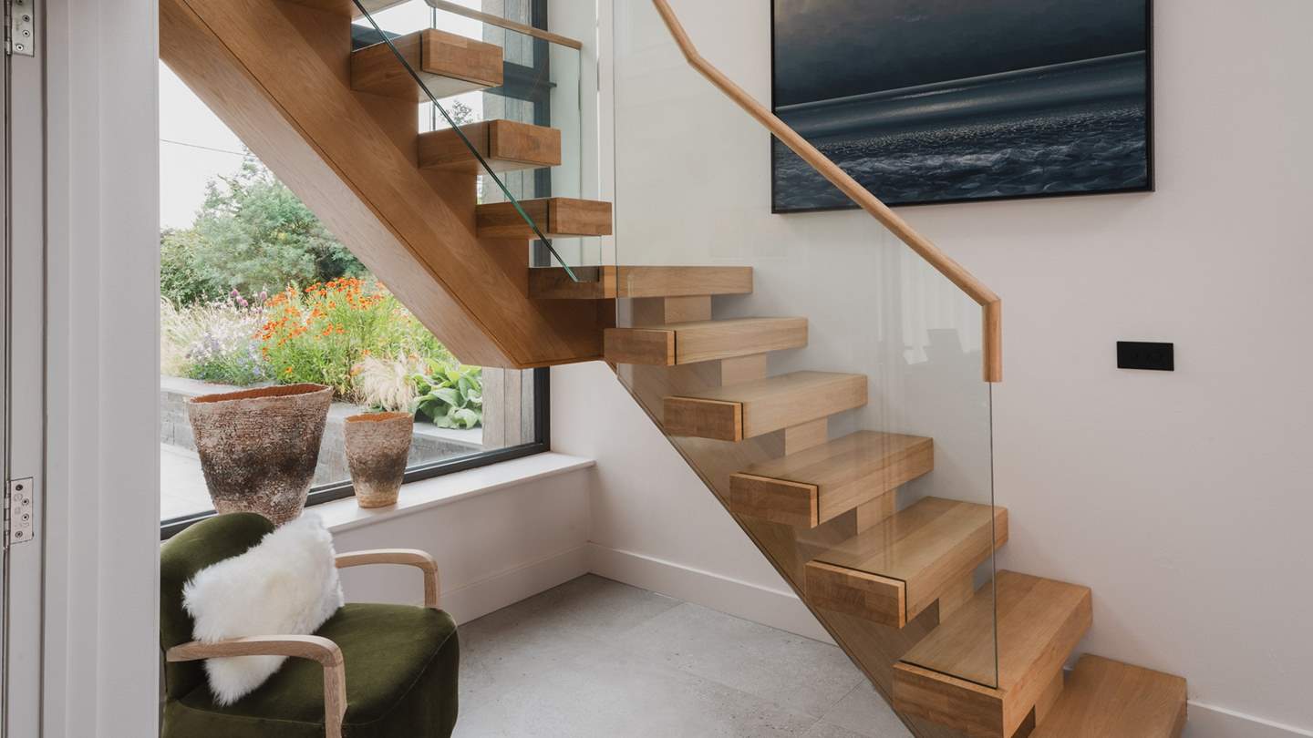 Follow the stairs to uncover three equally calming bedrooms...