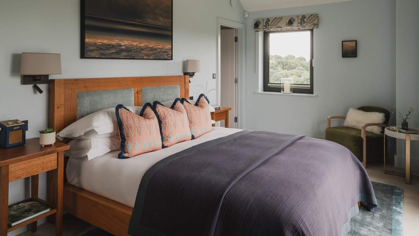 A sanctuary for slumber with soothing blue hues, the master bedroom space promises a super-king size oak bed, swathed in luxurious linens 