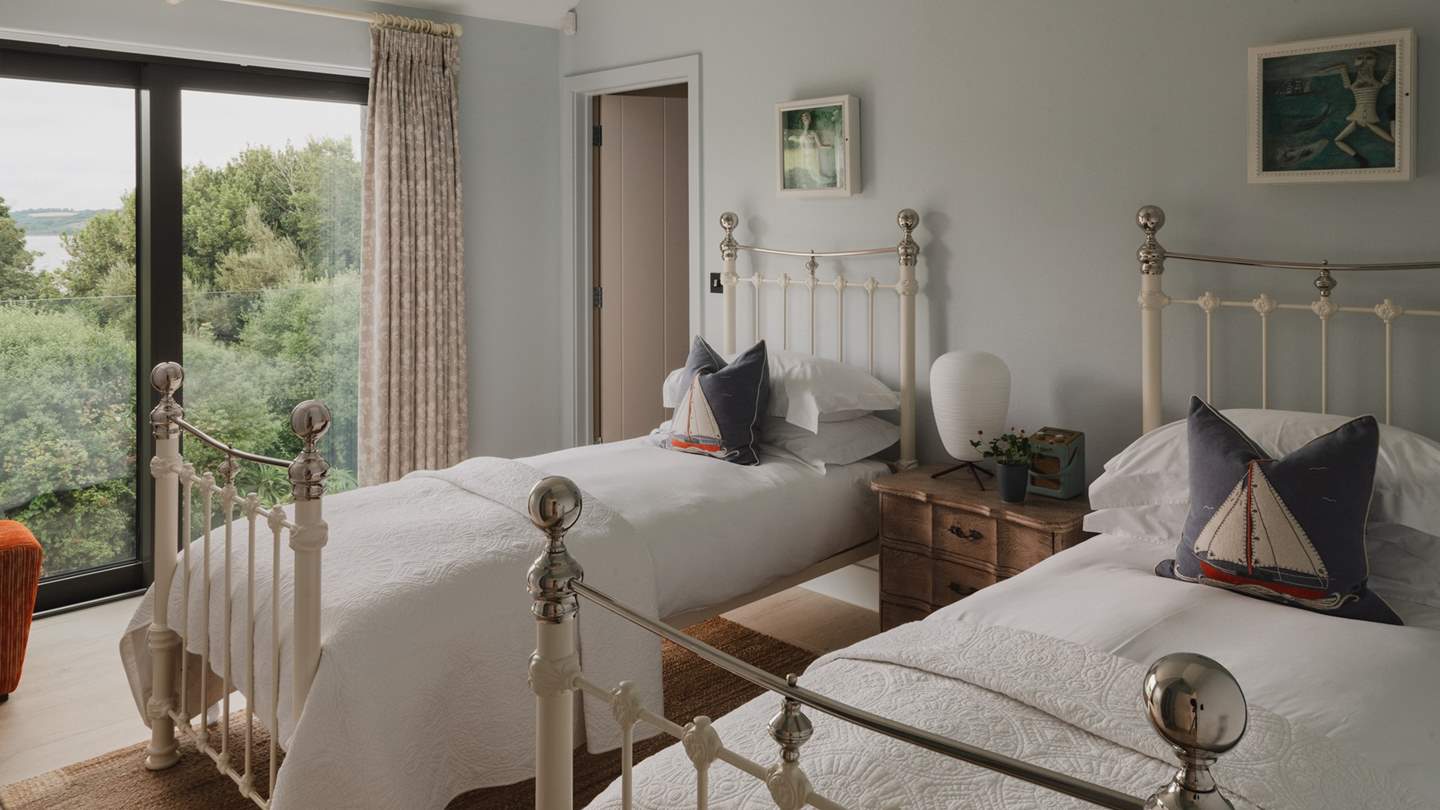 Along the corridor resides the pale blue twin bedroom