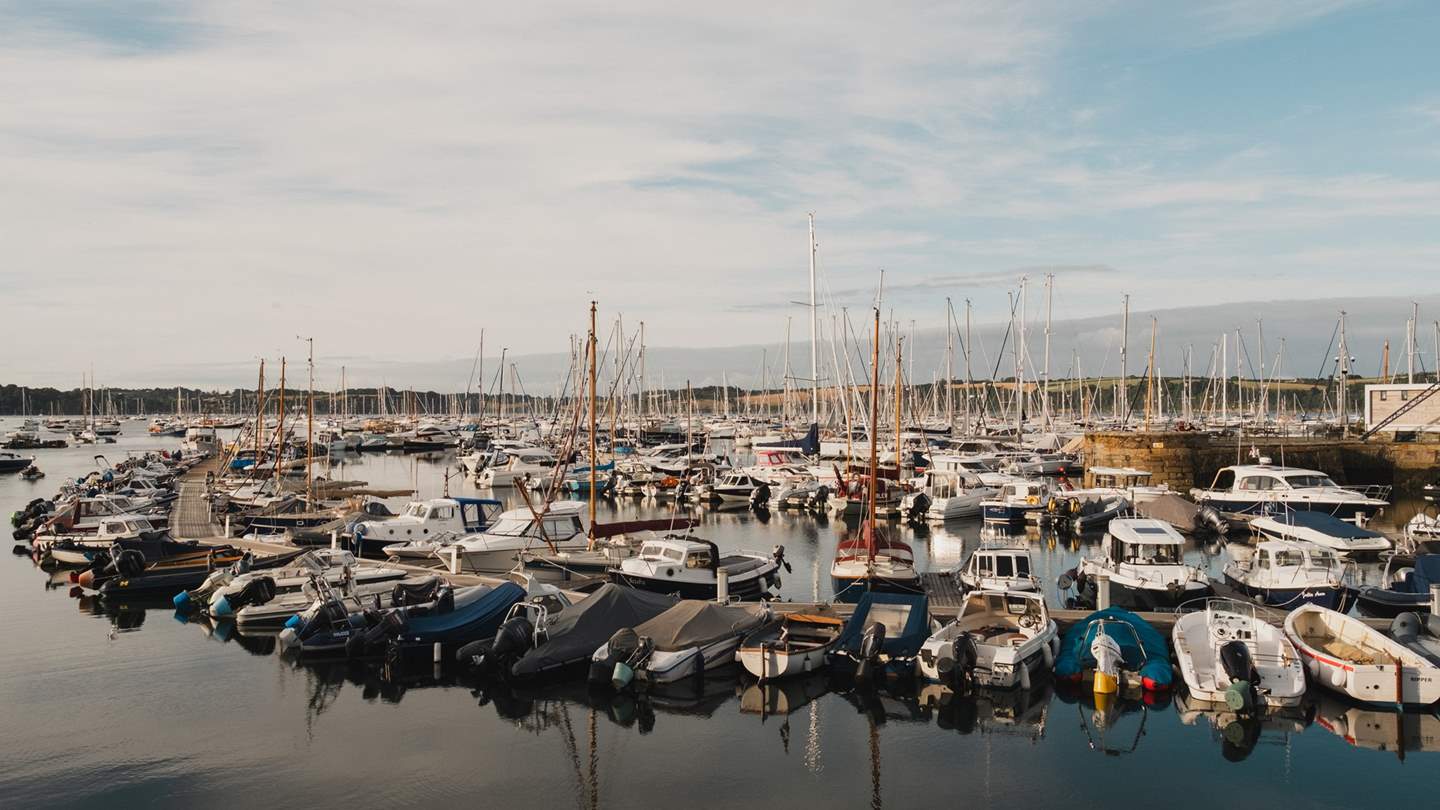 Admire the gentle sway of boats in the pretty harbour 