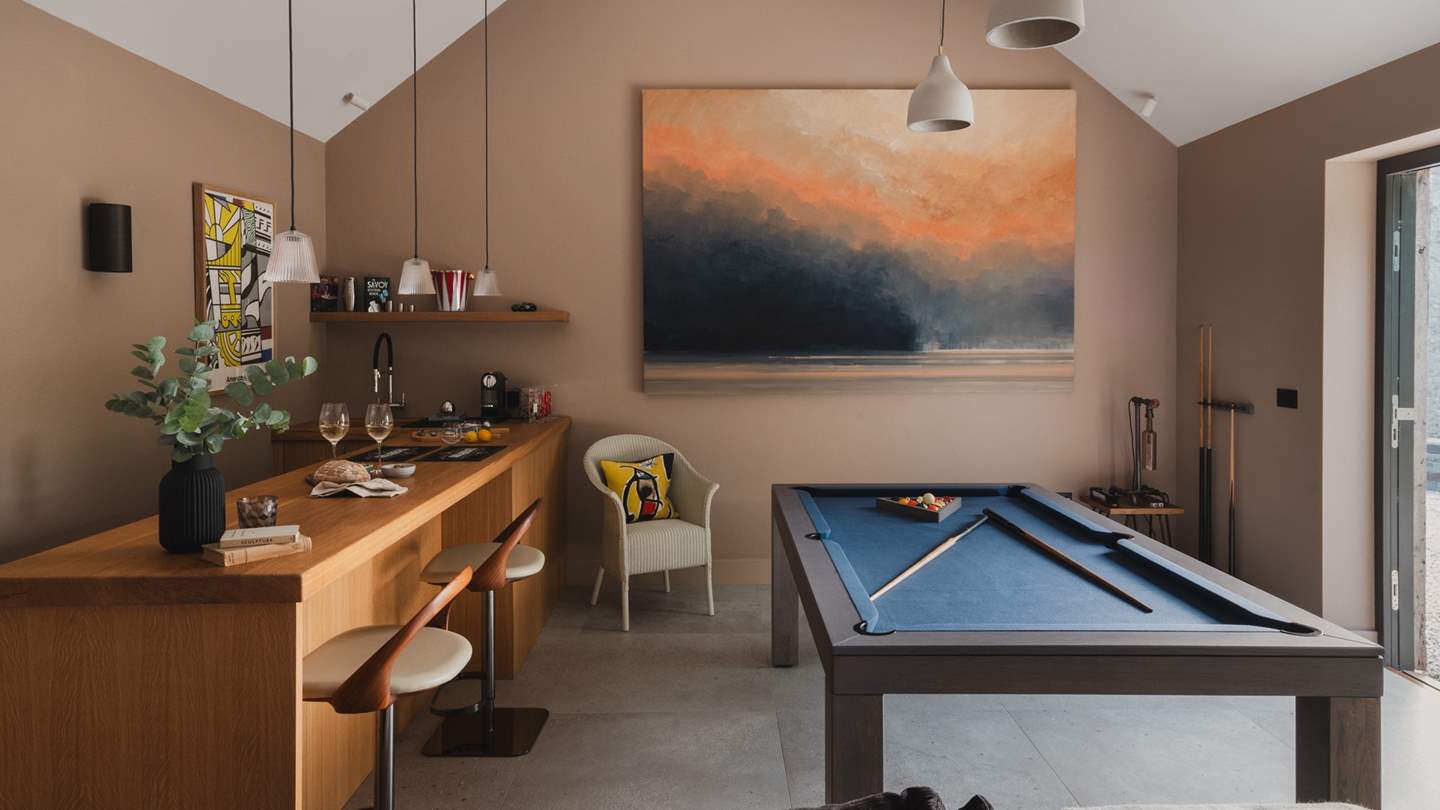 Settled in a separate outbuilding is a wonderful games room with a pool table and bar, designed for soirées of any occasion