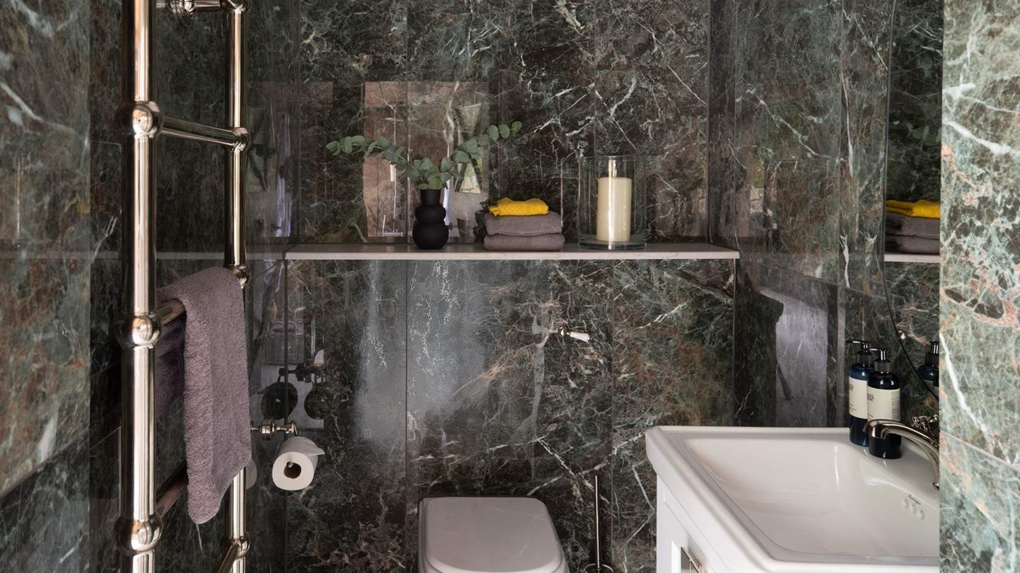 There is also a marble-adorned WC 