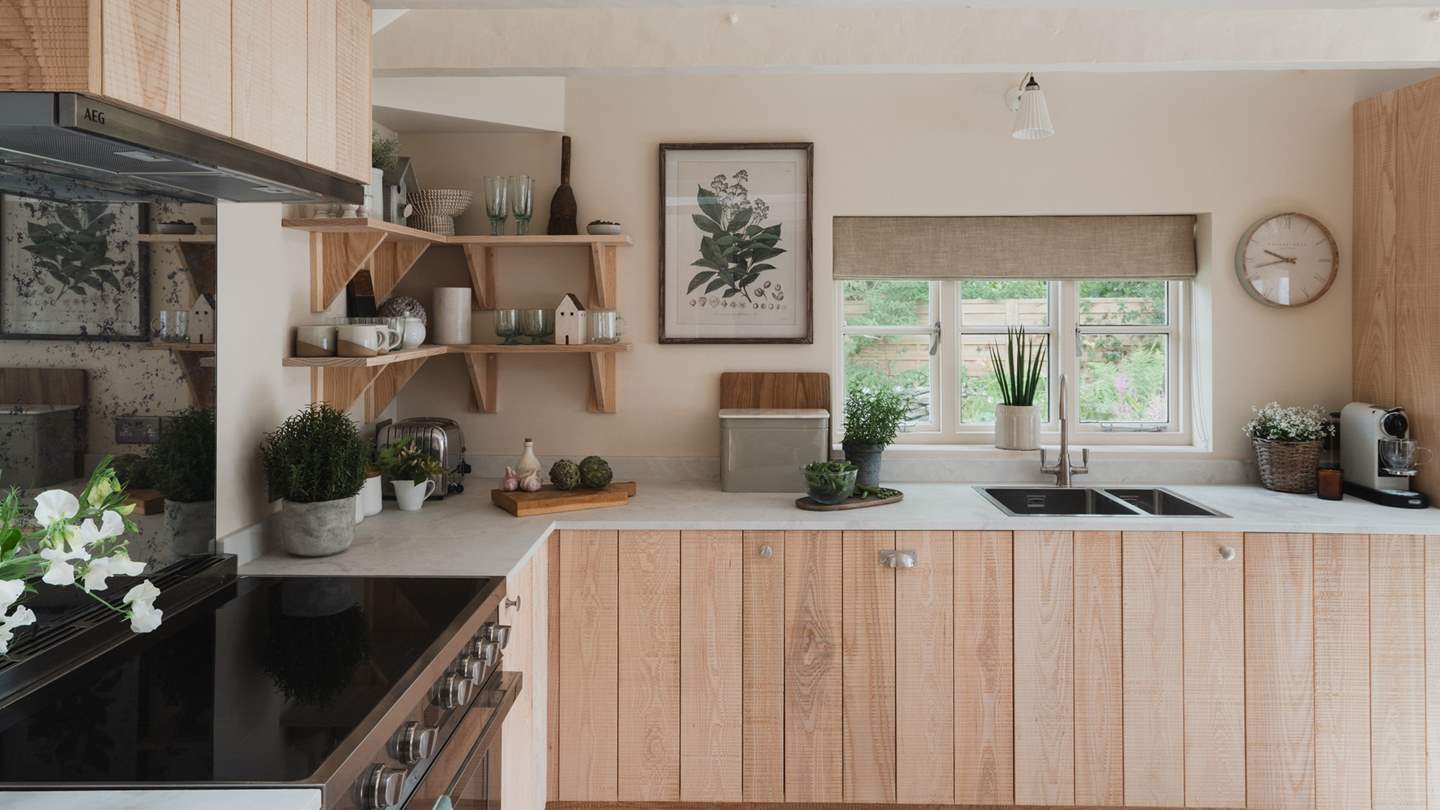 Dressed in calming earthy shades, the modern rustic kitchen is simply a dream