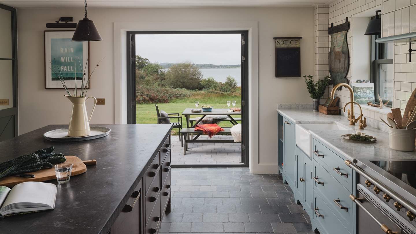 Enjoy sweeping waterside vistas from the kitchen, which has been thoughtfully curated by HAM Interiors 