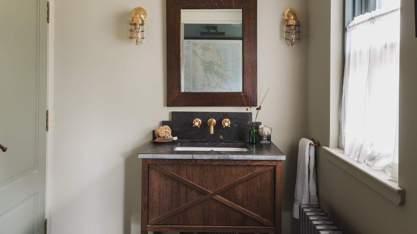 The downstairs washroom is designed in soothing earthy tones 