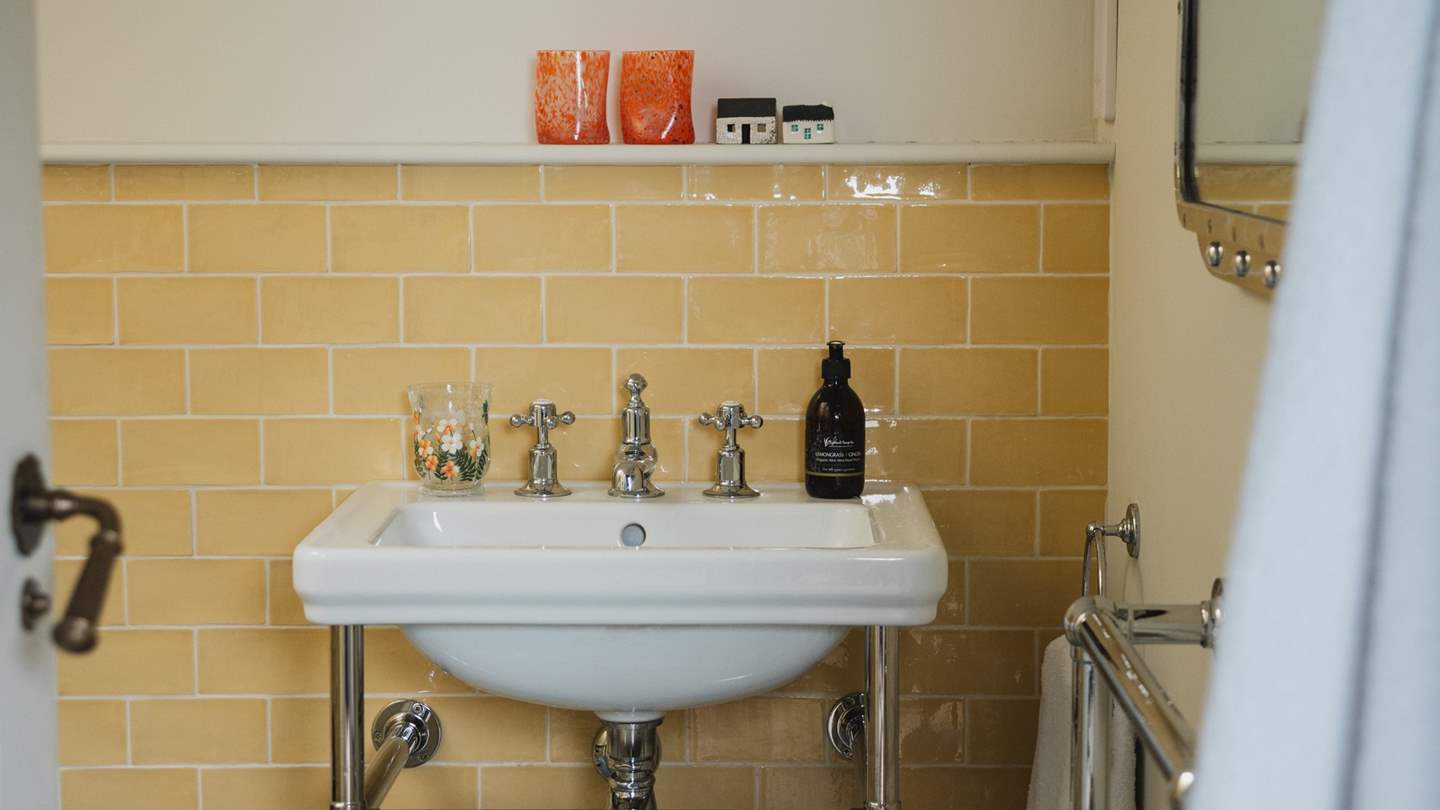 Bedroom two and three share access to the family shower room, complete with a walk-in rainfall shower