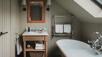 The master bedroom has a charming ensuite bathroom 