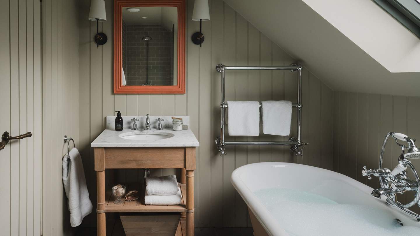 The master bedroom has a charming ensuite bathroom 