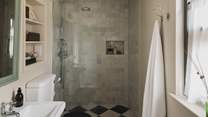 Discover the ensuite shower room, with a walk-in rainfall shower