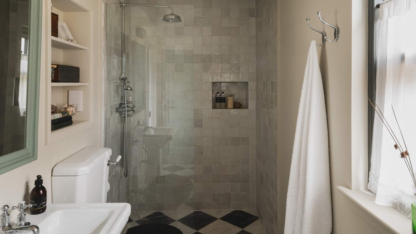 Discover the ensuite shower room, with a walk-in rainfall shower