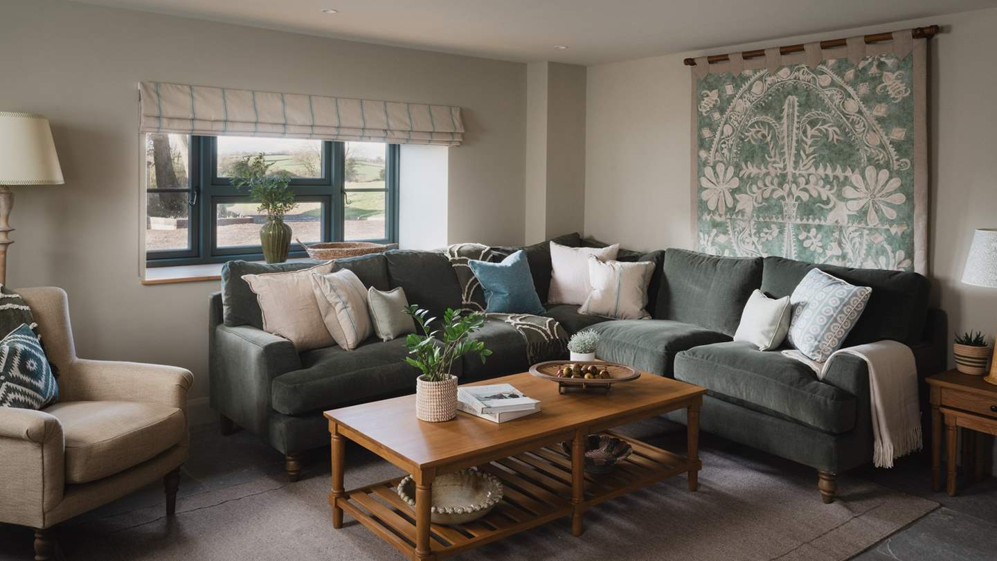 Sink into the calming embrace of the corner sofa in the second sitting room
