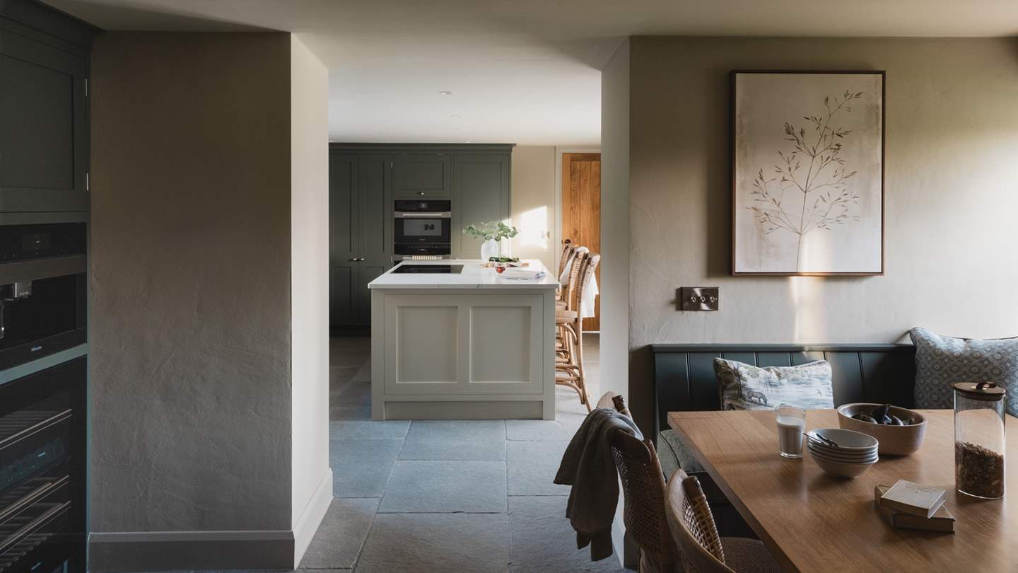 Beside the dining space is an integrated coffee station, with a Miele bean-to-cup coffee machine 