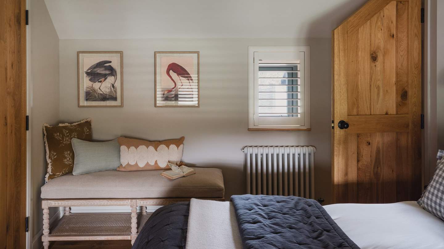 A A wall‑mounted TV allows for leisurely mornings in bed