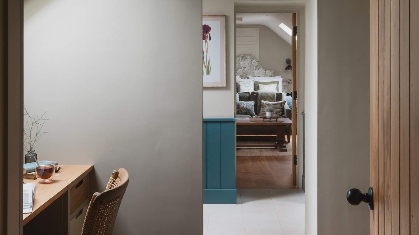 Stow away your belongings in the built-in chests of drawers, with a large walk-in wardrobe and dressing table beyond the ensuite bathroom