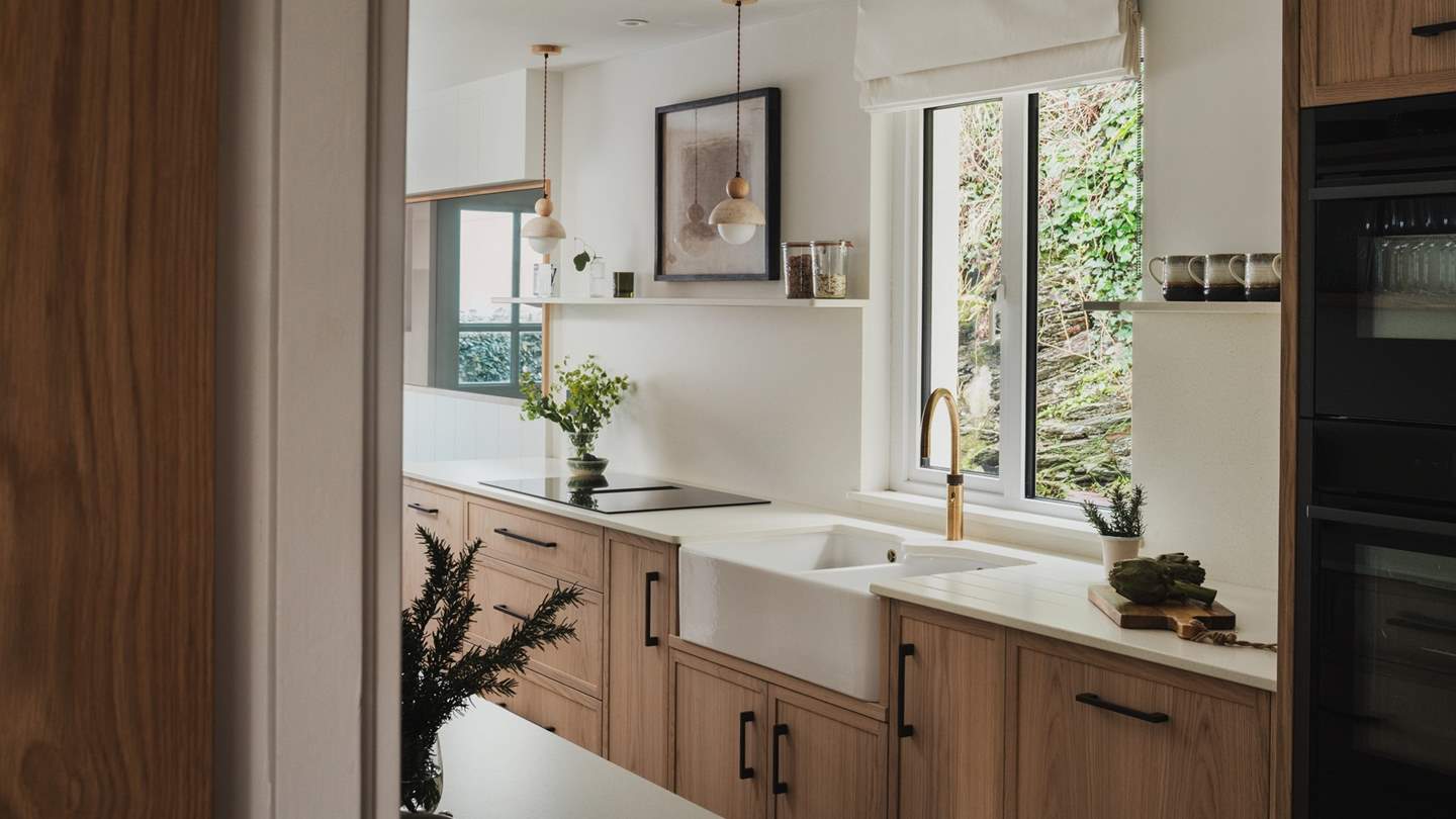 Head into the kitchen of Zephyr to find an inviting space, where soft hues complement clean lines and earthy touches