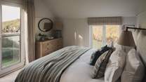 The second bedroom offers uninterrupted views to savour at the start and end of each day 