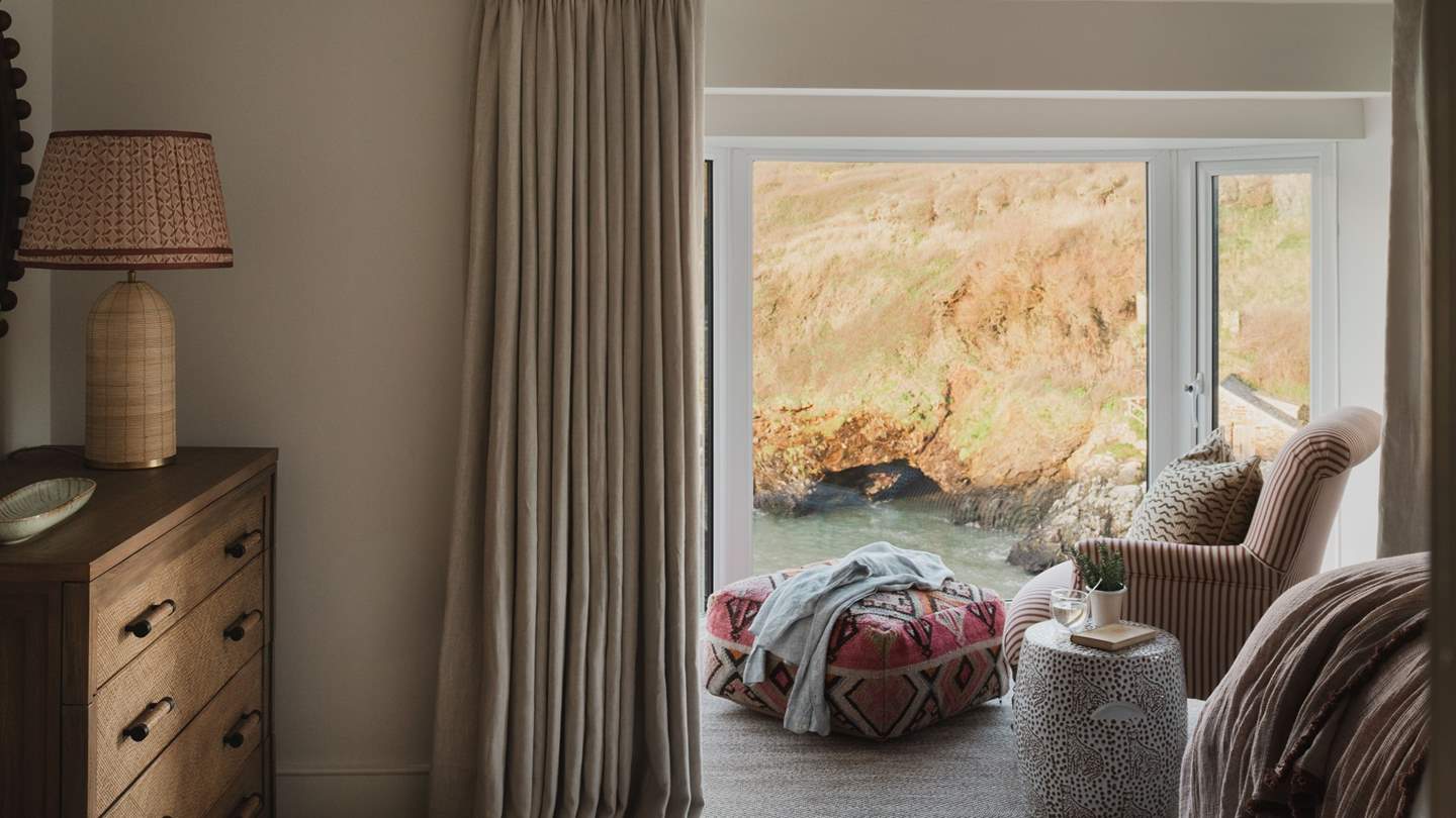 Settle into the window-side armchair with a handwoven pouffe for lingering moments over a flat white