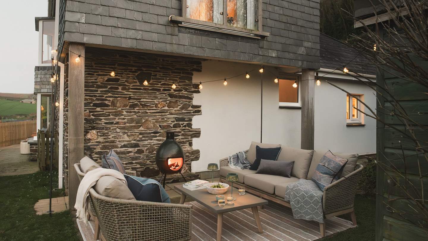 Festoon-lit evenings await in the outdoor sofa space