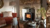 Warm yourself by the cosy wood burner...