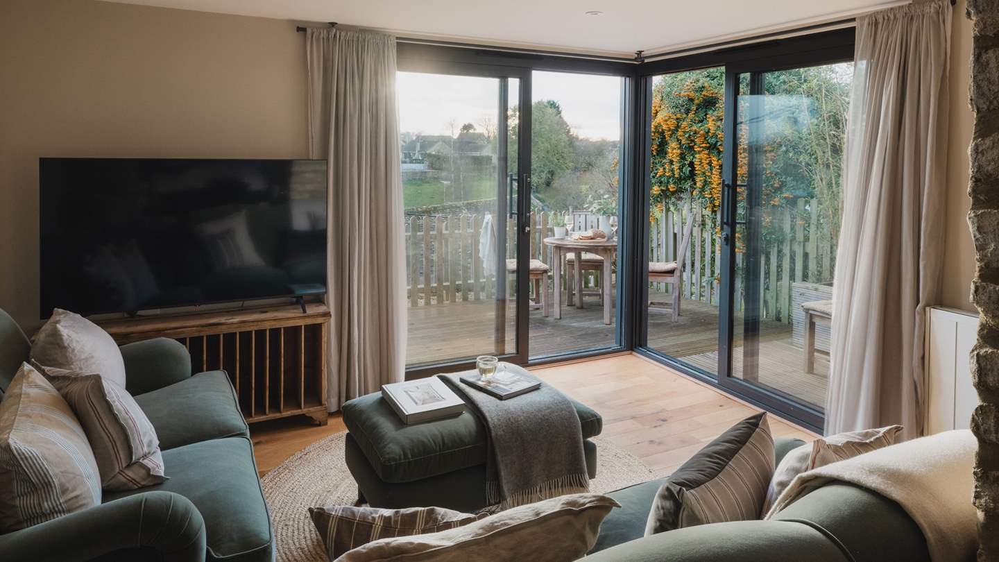 Roll open the glass sliding doors on balmy days to welcome floral scents from the magnificent pyracantha...