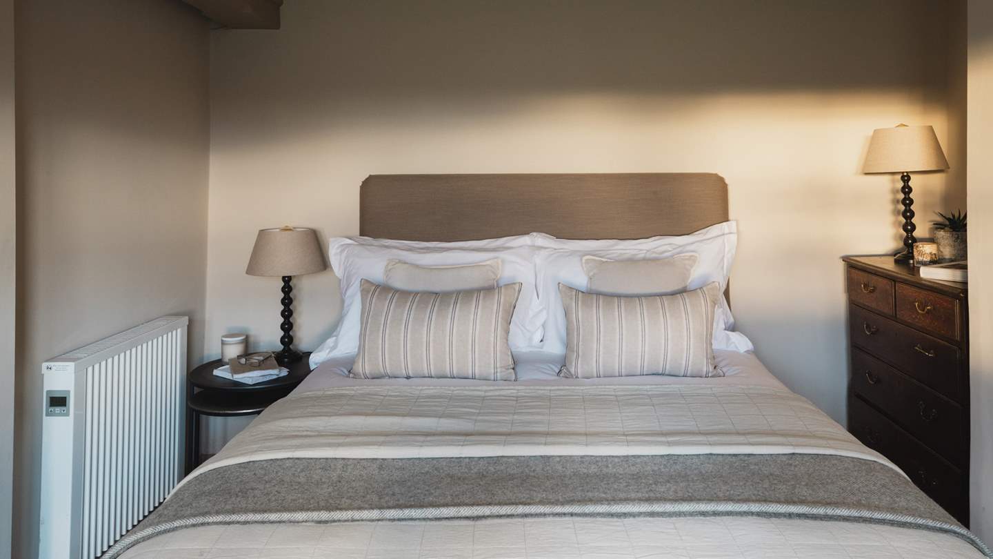 The second bedroom bathed in sunlight promises lingering staycation lie-ins...