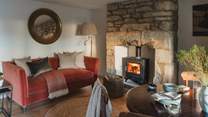 Warmed by a wood burning stove, the dining area is a cosy setting for slow moments over flavourful feasts