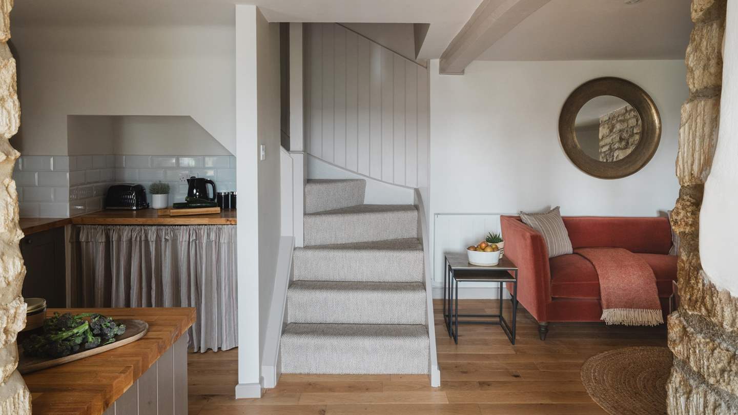 Take the stairs to uncover two equally beautiful bedrooms...
