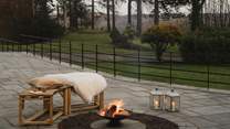 Settle beside the crackling firepit at sundown