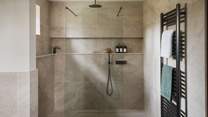 The dual shower invites indulgent rainfall moments to share