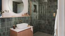 A large rainfall shower invites spa-like serenity