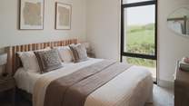 A rustic chest of drawers provides ample storage