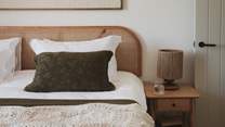 Framed by verdant views and a sumptuous king size bed for restful nights amidst cloud-soft linens